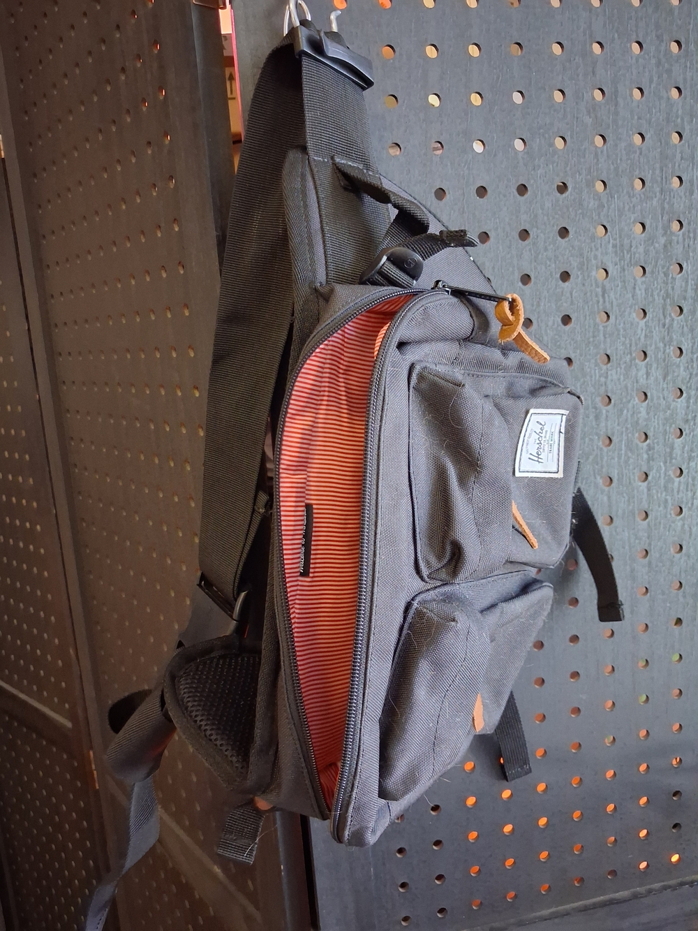 Herschel Supply Co. Black Sling Bag with Orange-Striped Interior